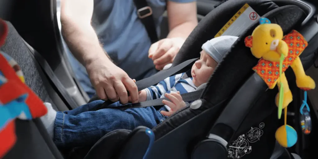 baby strapped in car seat