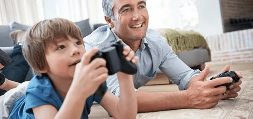 dad and kid playing video games
