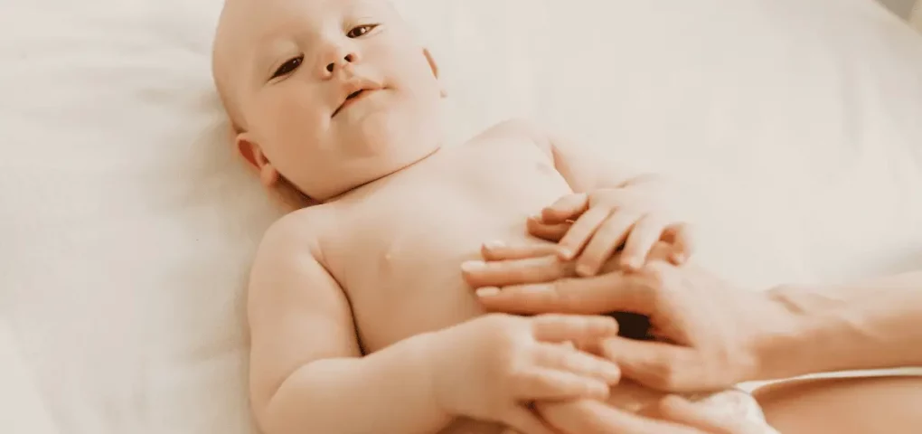 massaging baby's tummy in circular motion